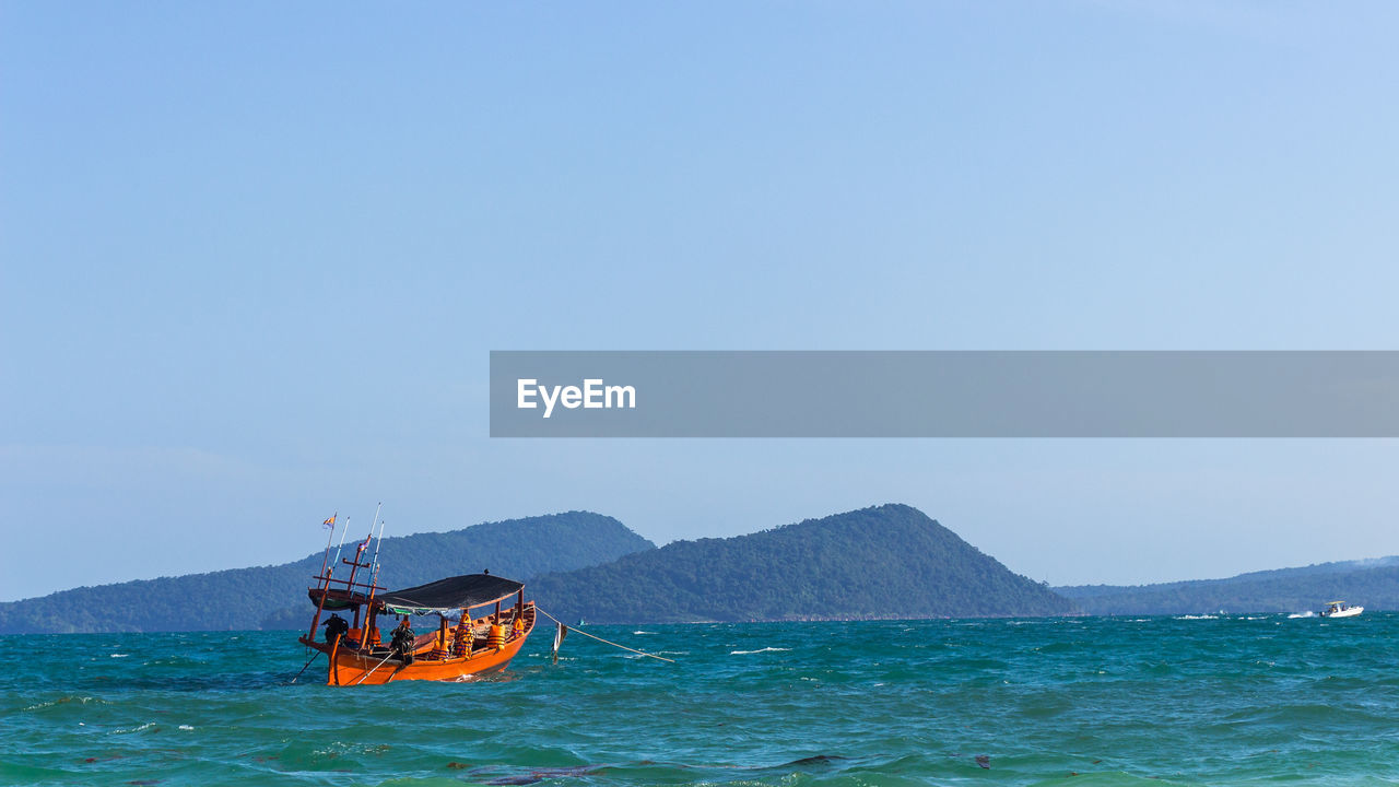 Scenic view of sea against clear sky