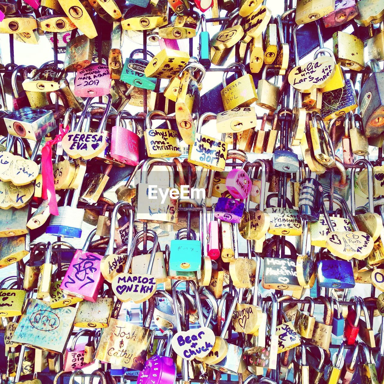 FULL FRAME SHOT OF LOVE PADLOCKS HANGING ON GRAFFITI