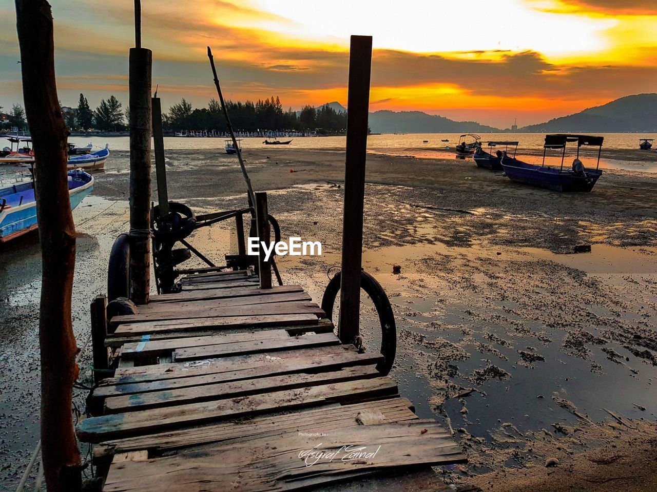 SCENIC VIEW OF BEACH DURING SUNSET