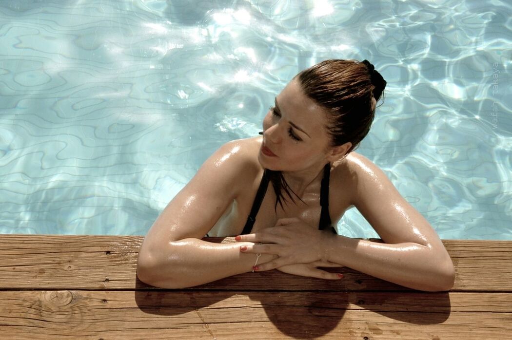 Young woman looking away in swimming pool