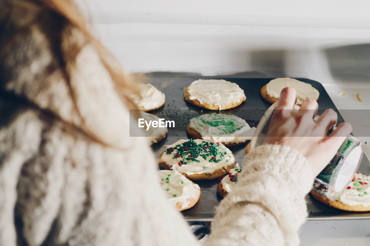 Close-up of woman preparing food at home