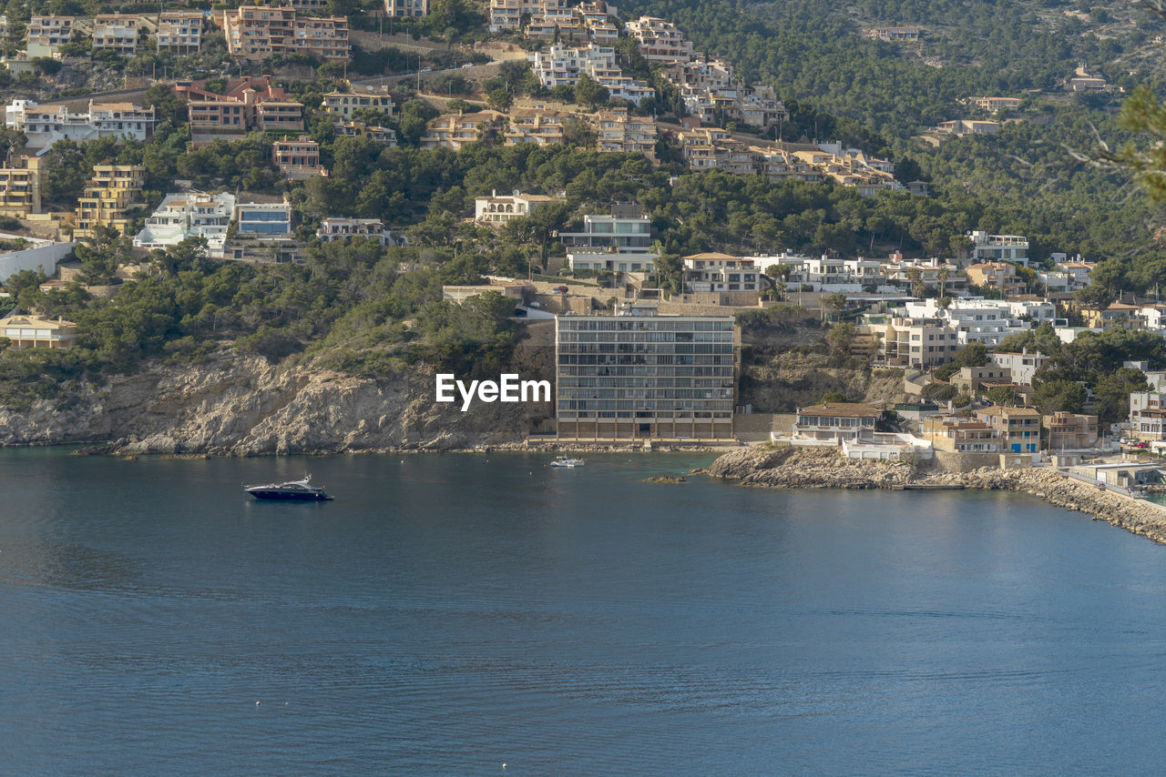 High angle view of townscape by sea