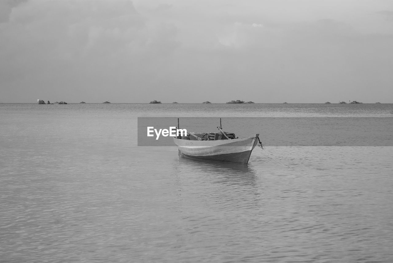 VIEW OF BOATS IN SEA