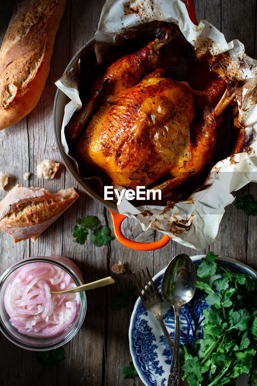 From above beautiful thanksgiving dinner with roasted chicken pollo pibil on wooden table