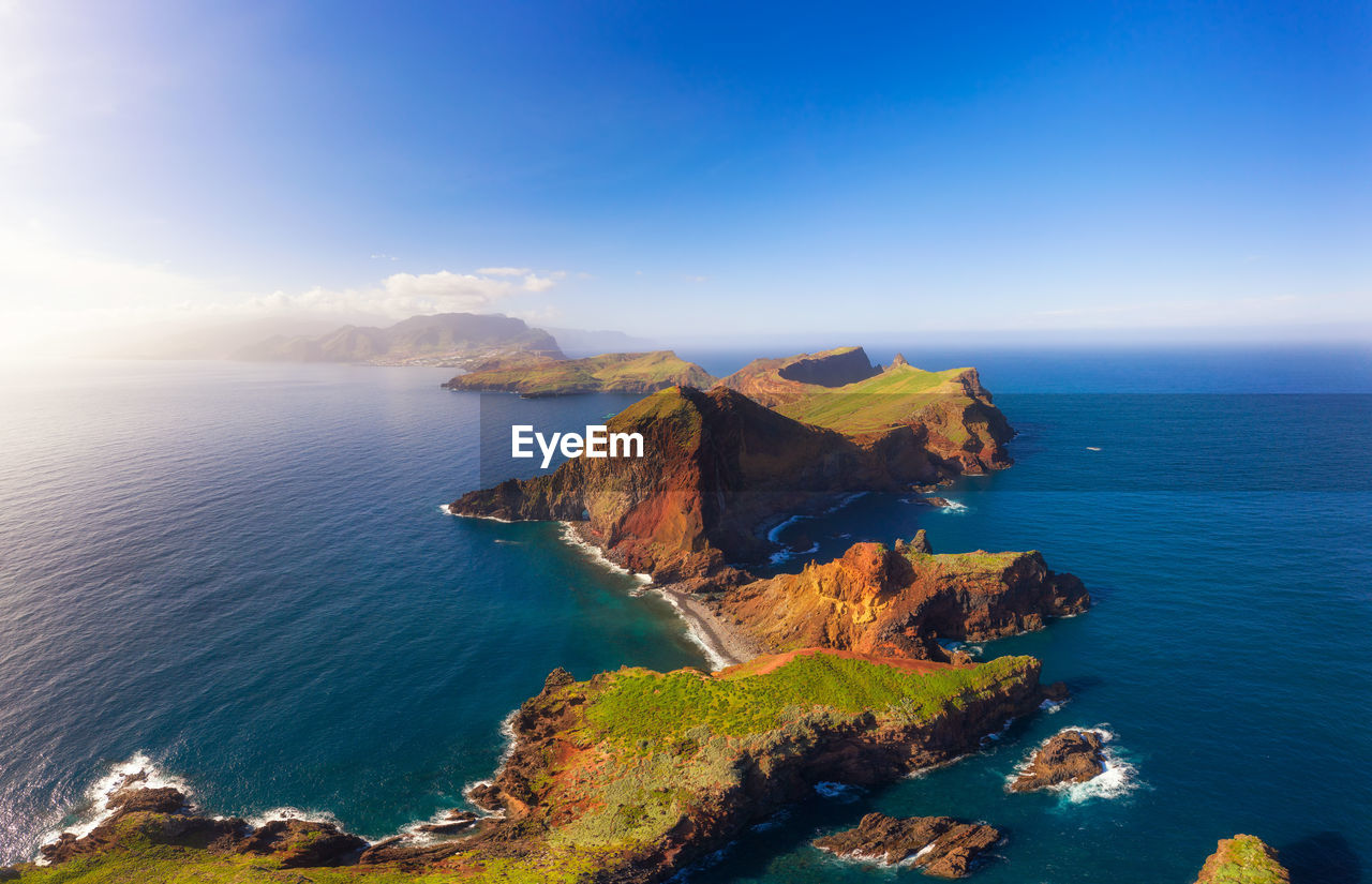 SCENIC VIEW OF SEA AND ROCKS AGAINST SKY