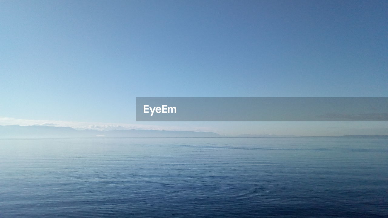 SCENIC VIEW OF BLUE SEA AGAINST CLEAR SKY