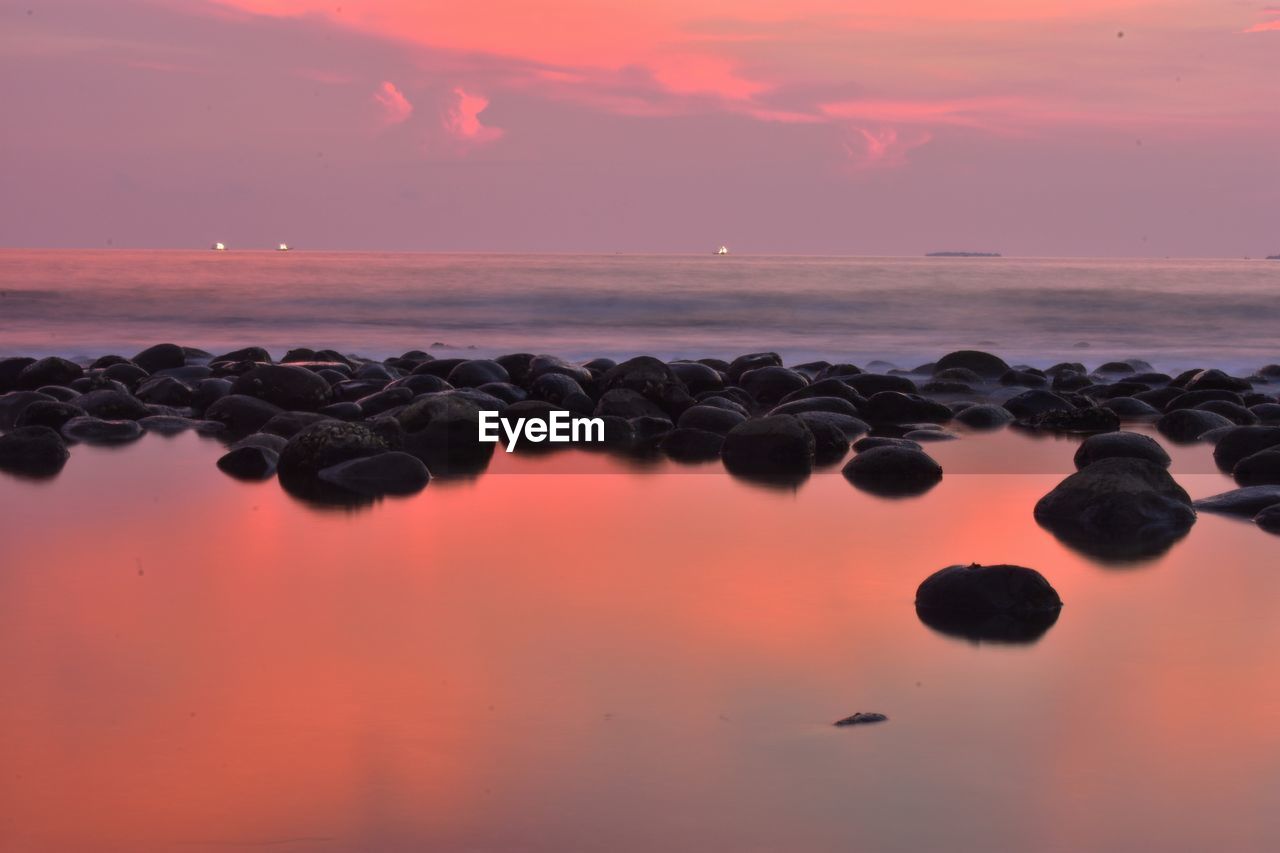 Scenic view of sea against sky during sunset