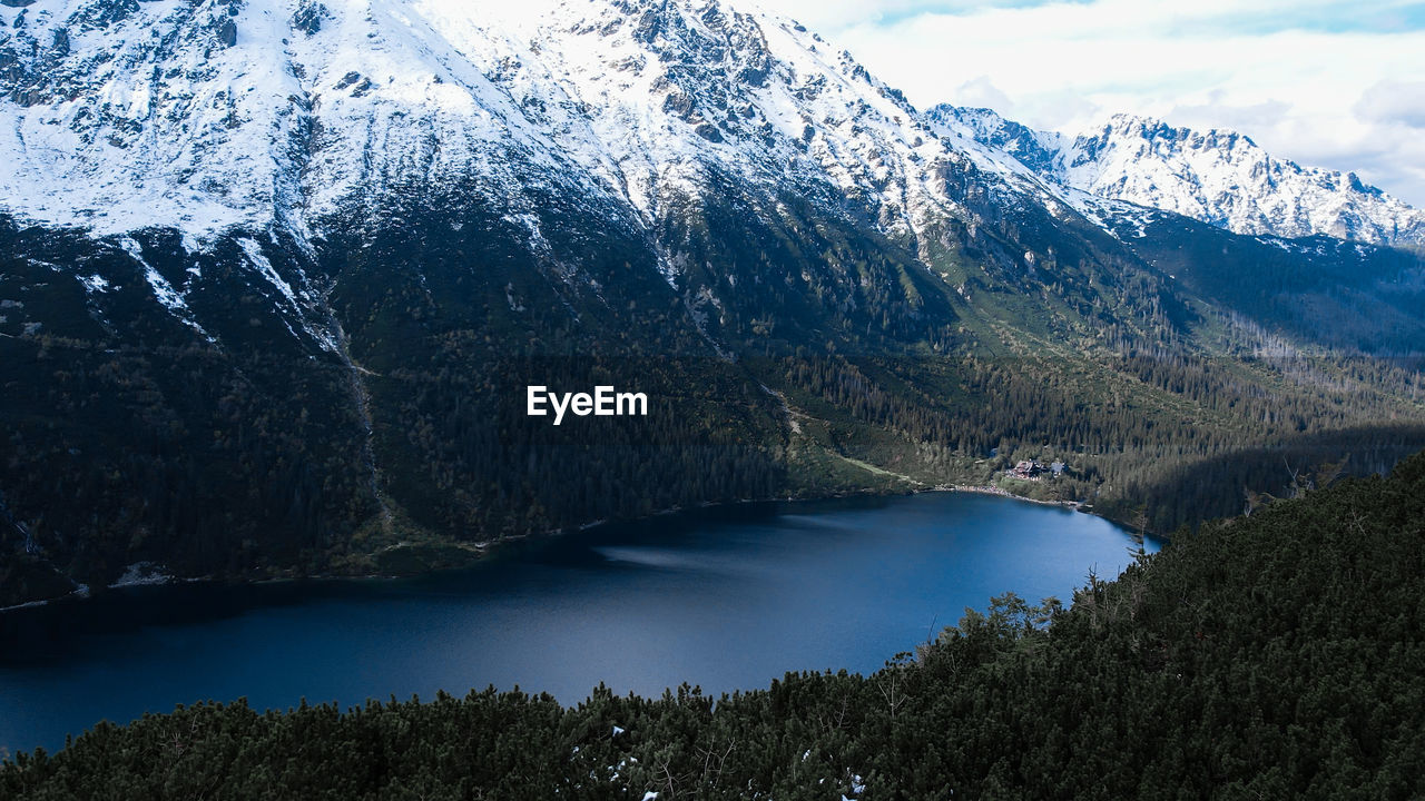 Czarny staw pod rysamy or black pond lake near the morskie oko snowy mountain hut in polish tatry