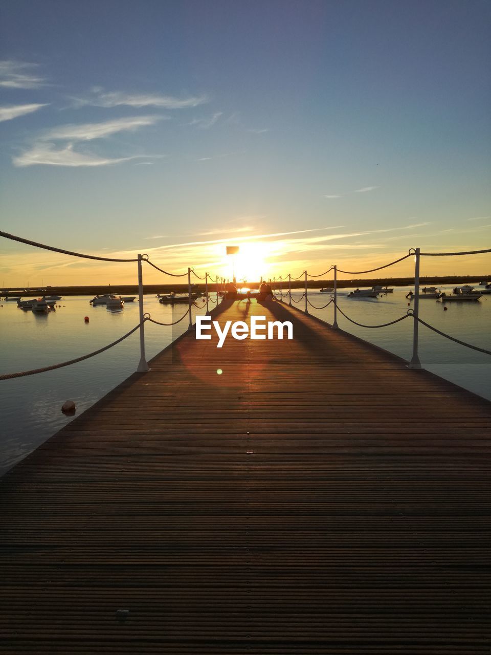 View of pier at sunset