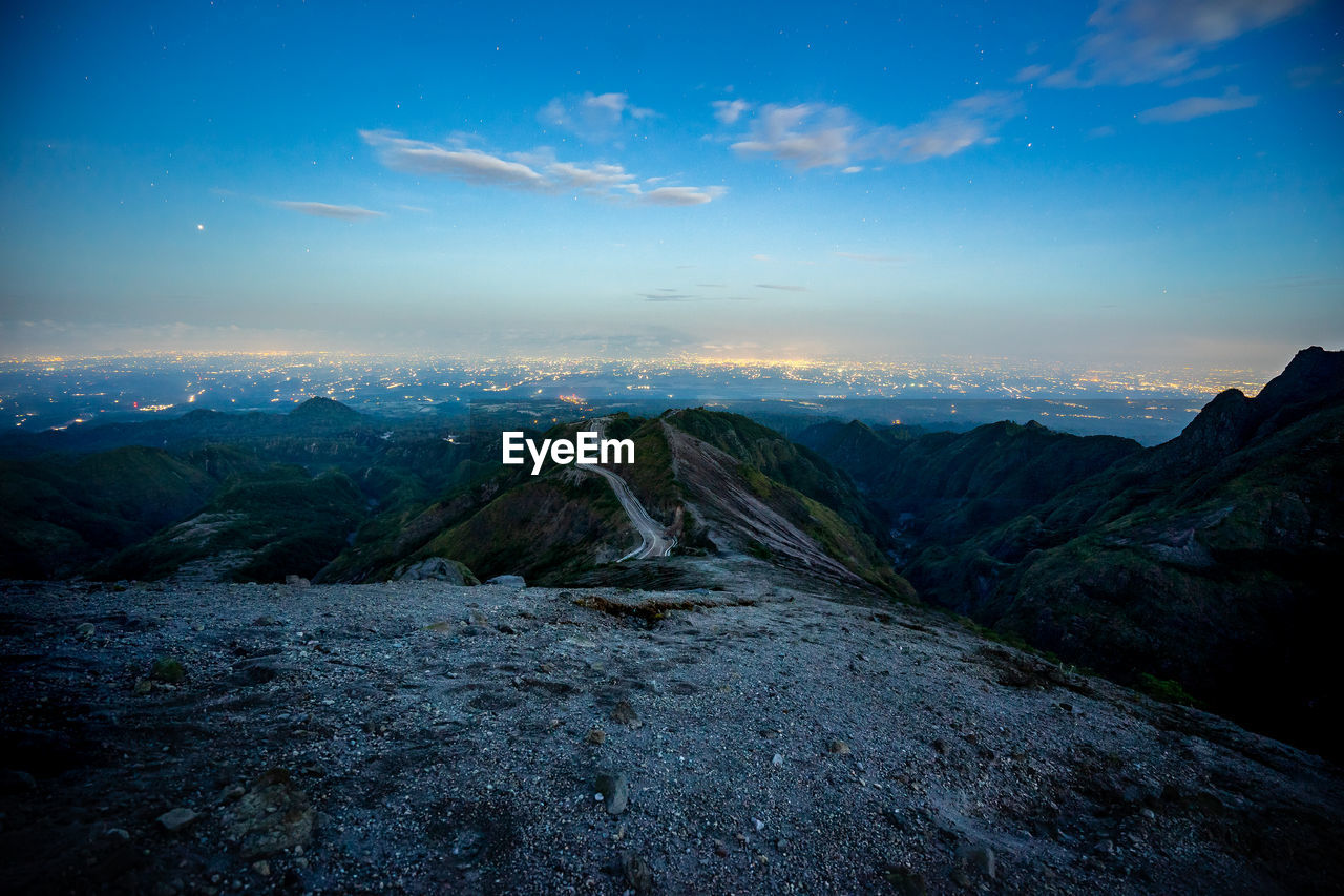 SCENIC VIEW OF LANDSCAPE AND MOUNTAINS AGAINST SKY