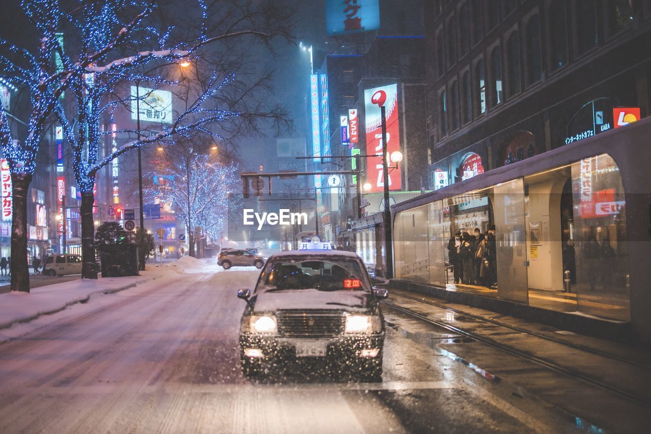 cars on city street at night