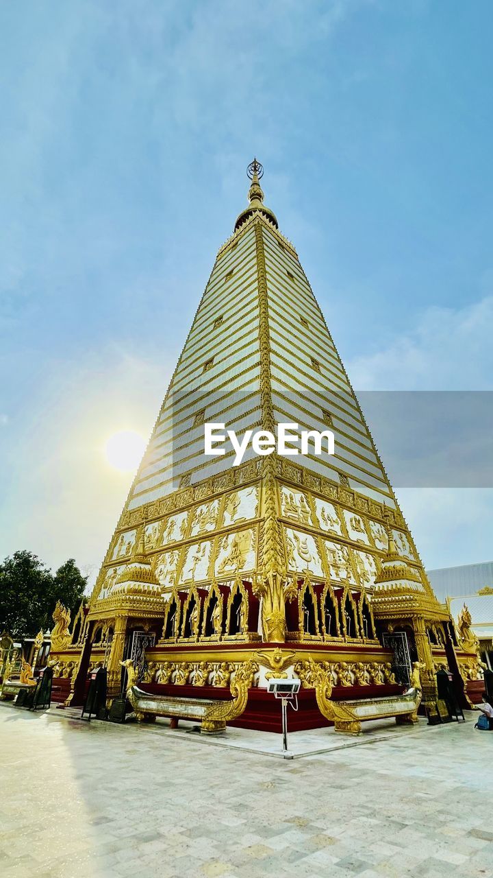 architecture, landmark, built structure, sky, religion, temple, building exterior, belief, travel destinations, temple - building, spirituality, travel, place of worship, nature, building, history, the past, cloud, tower, tourism, day, city, outdoors, gold, no people, dome