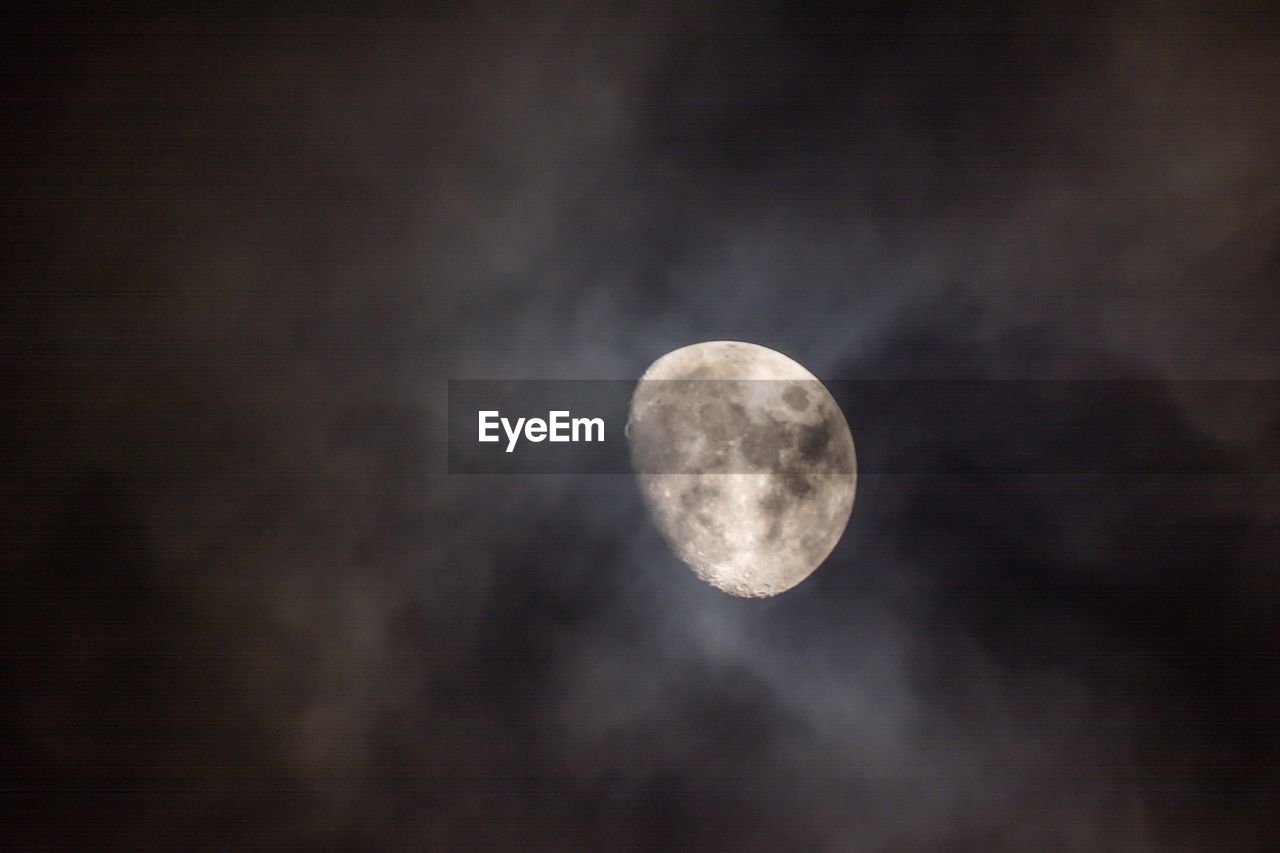 Low angle view of moon against sky at night