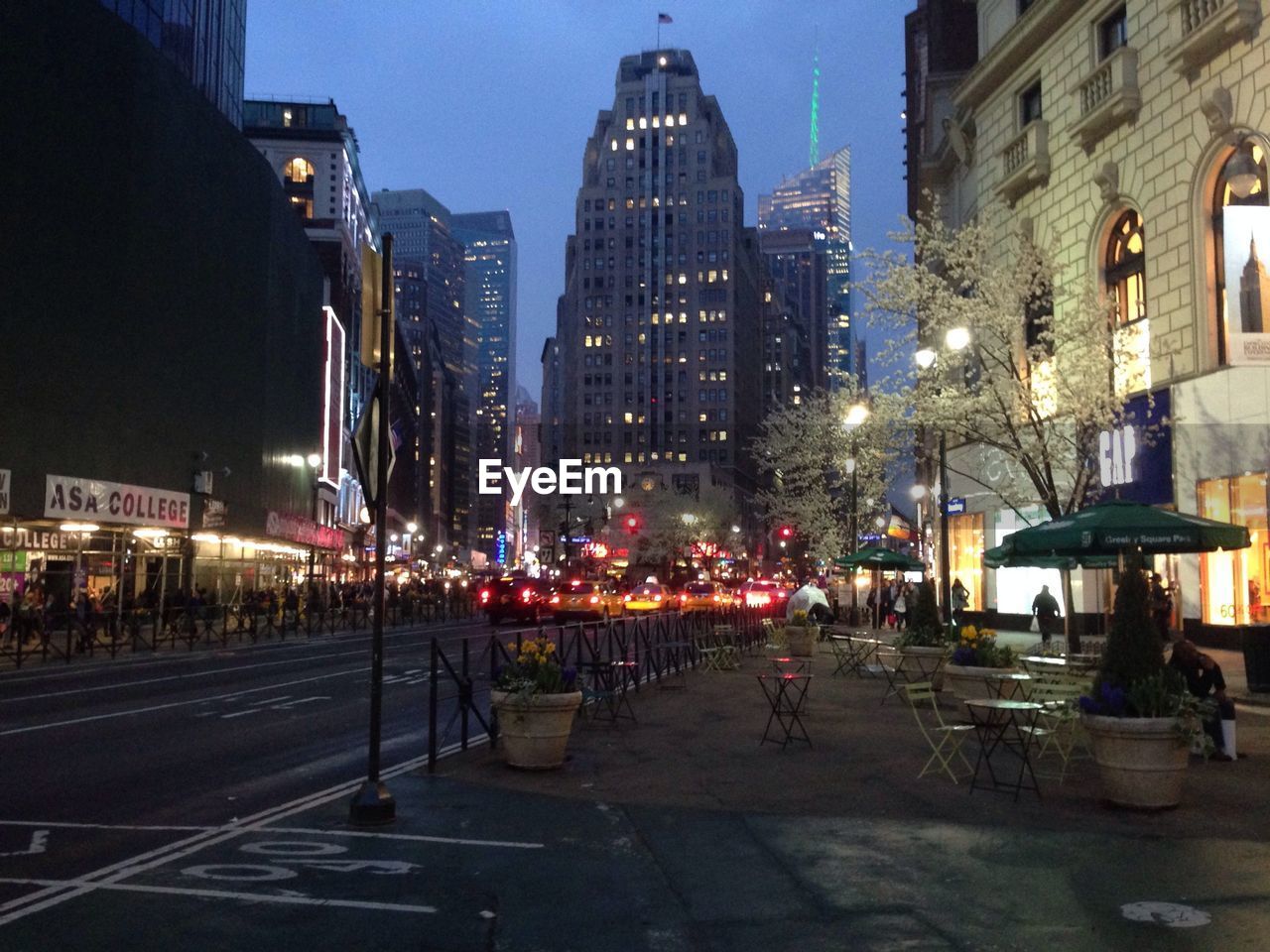 VIEW OF ILLUMINATED CITY AT NIGHT