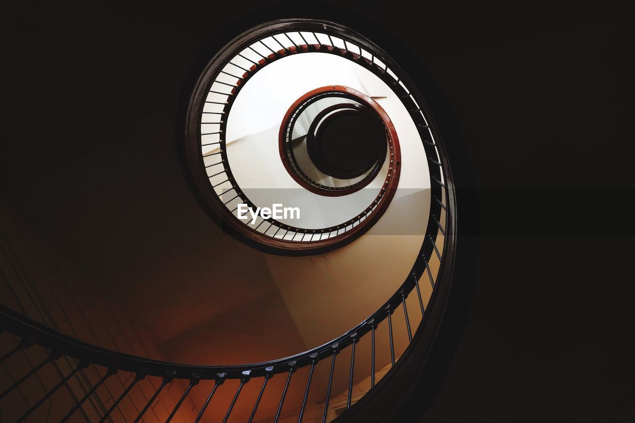 Low angle view of spiral staircase in building