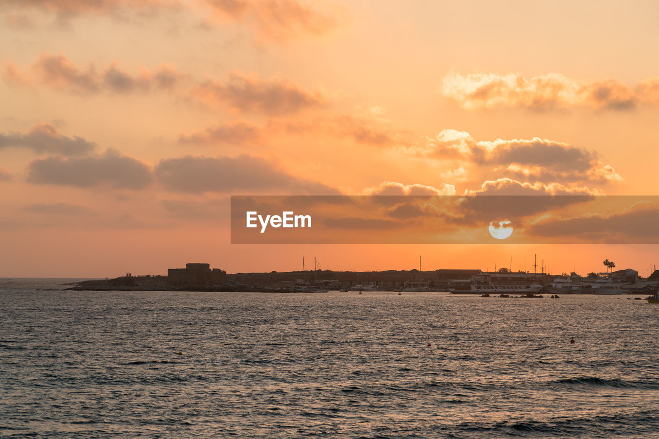 Scenic view of sea against sky at sunset