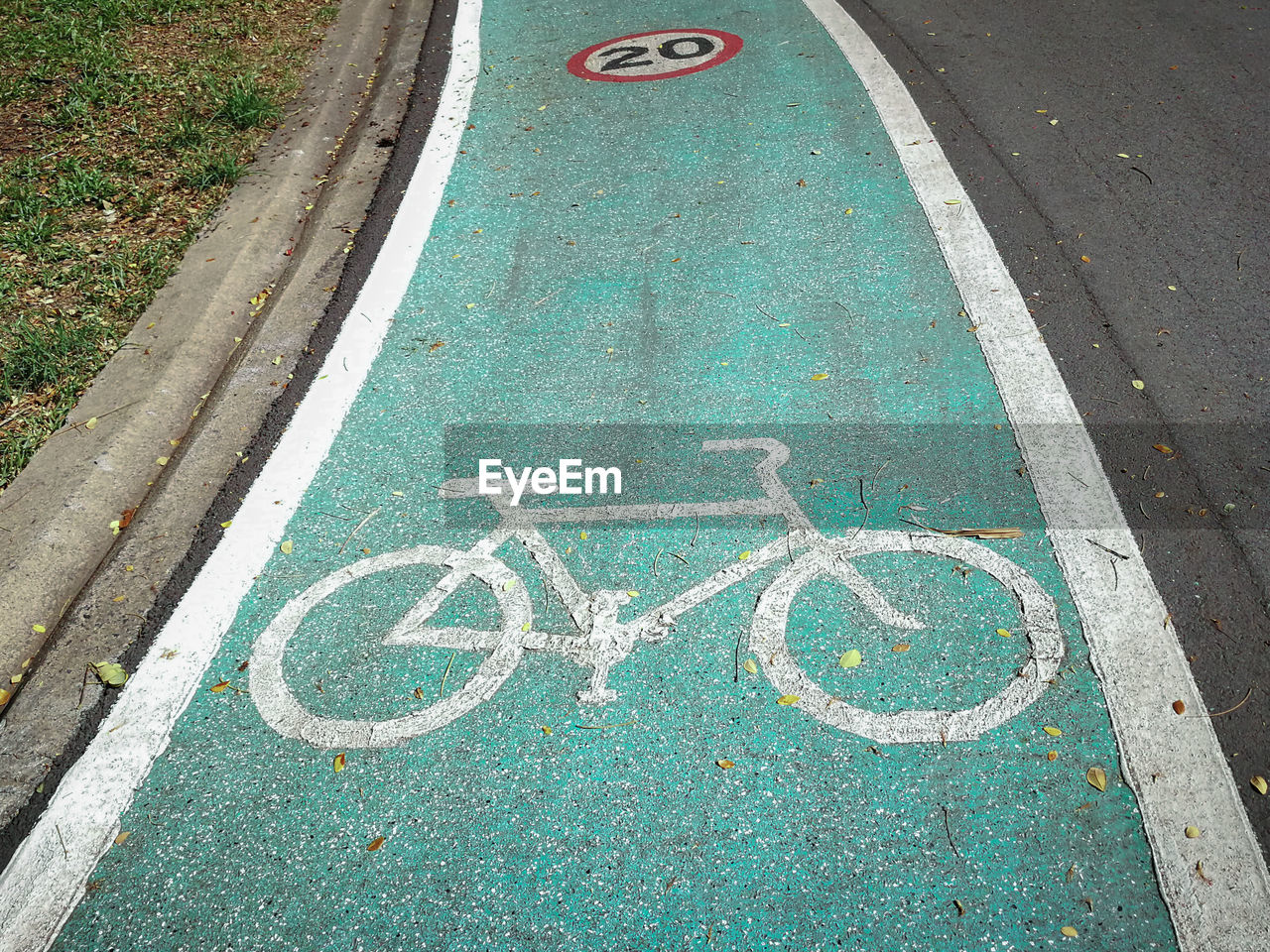 High angle view of bicycle lane sign