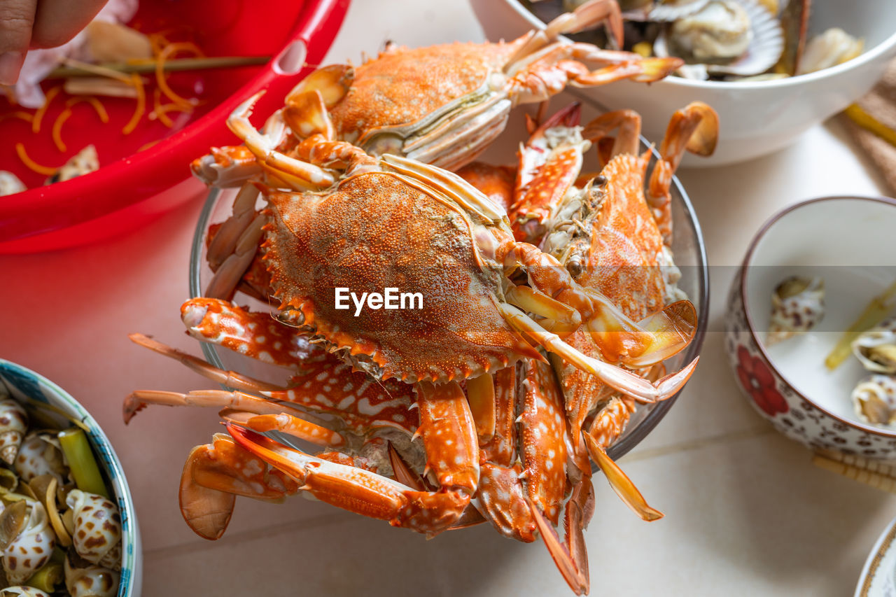 Bowl of delicious cooked crabs in seafood party at home