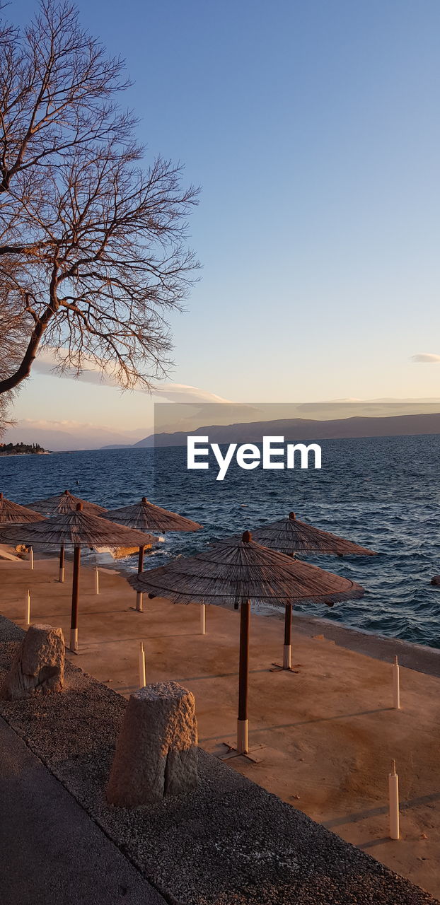 Scenic view of sea against clear sky during sunset