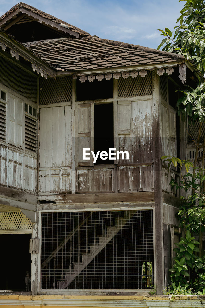 Old weathered wooden house built in 1912 in kuala kangsar, perak, malaysia.