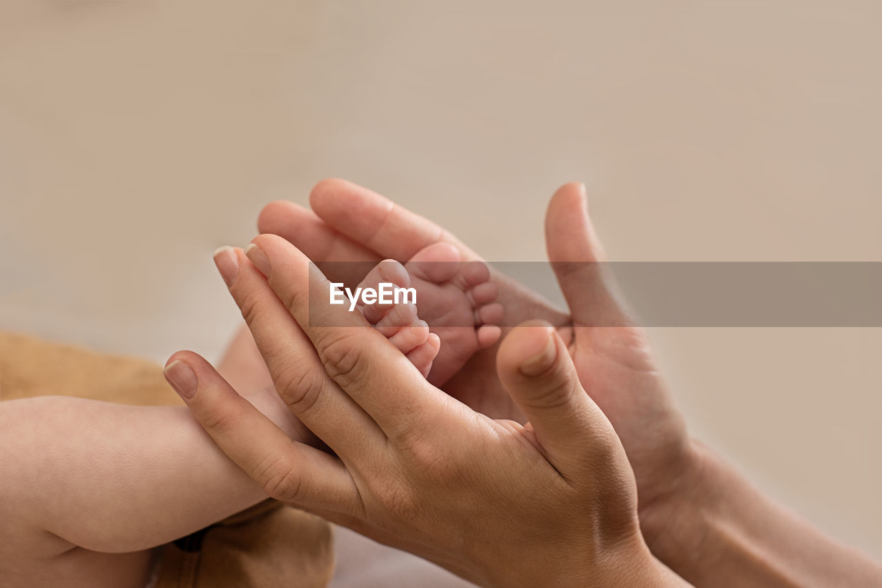 Newborn baby feet. motherhood concept. mother day. copy space. selective focus