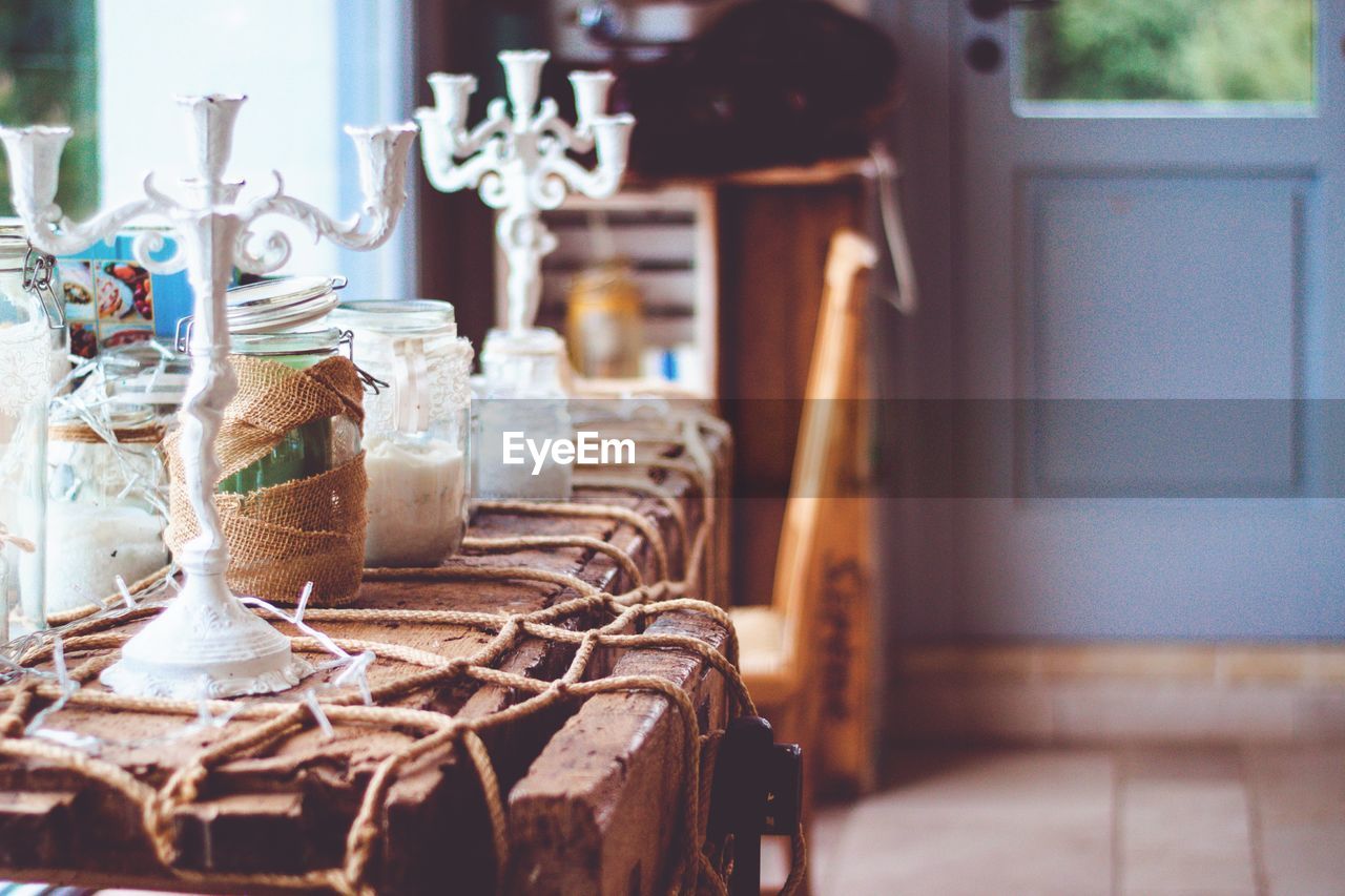 Close-up of glass jar on table at home