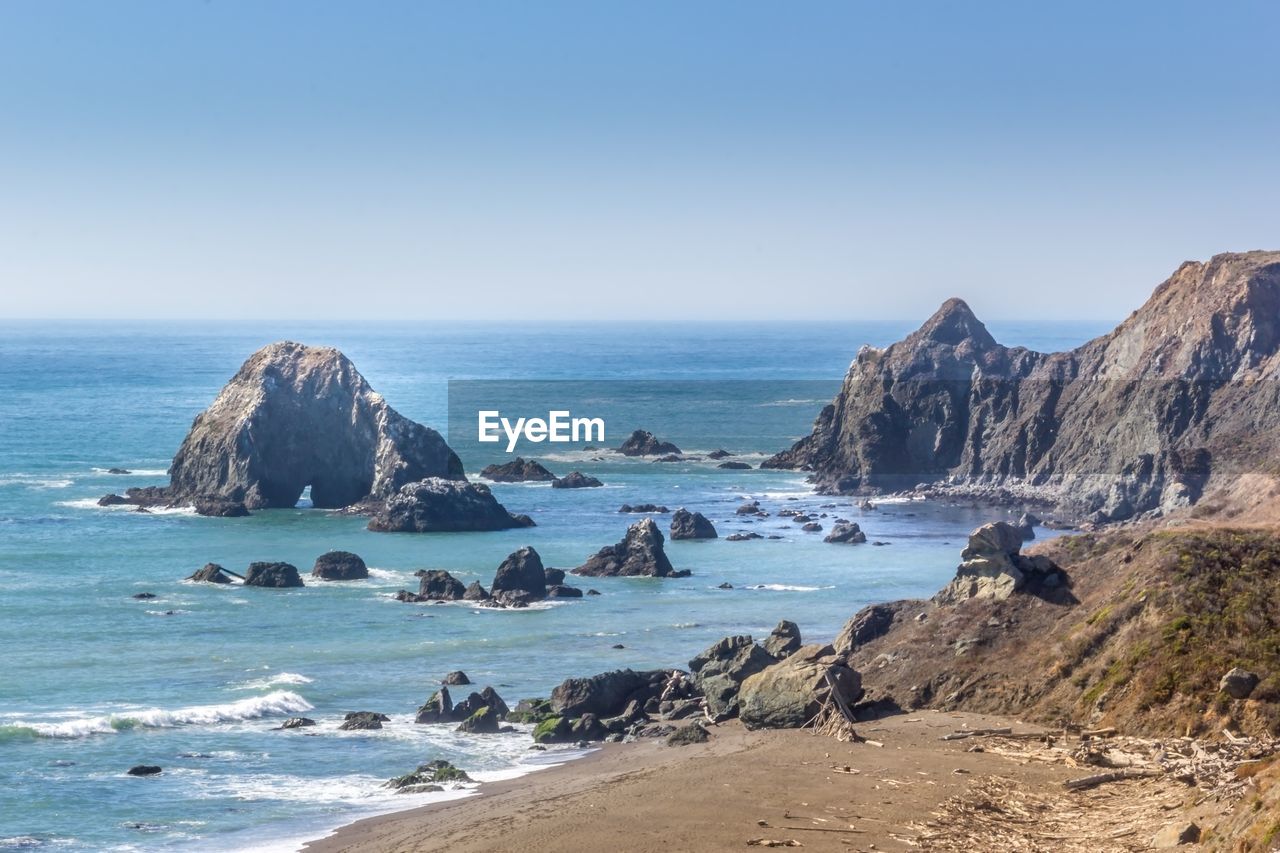 Scenic view of sea against clear blue sky