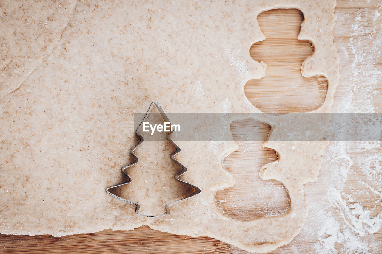 High angle view of dough on wooden table