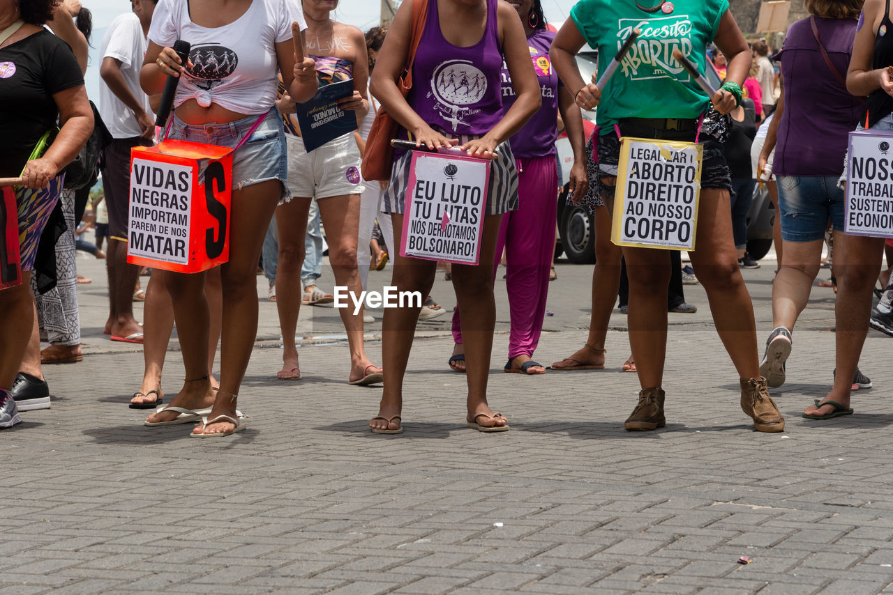 Women are seen protesting during the women day march in the city of salvador, bahia.