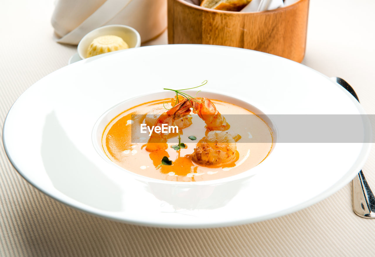 Close-up of soup served in bowl on table