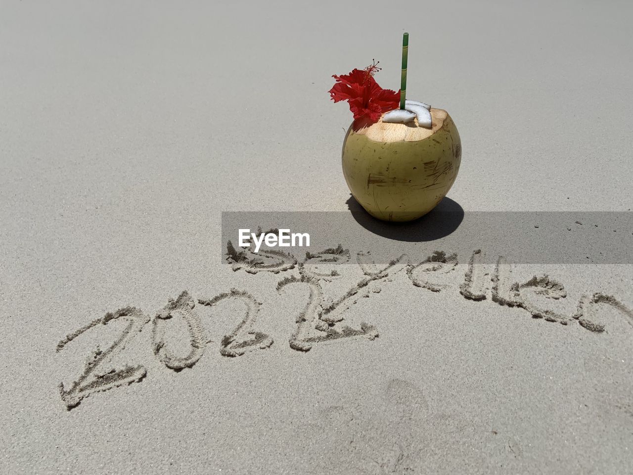 sand, text, fruit, beach, land, food and drink, western script, food, nature, healthy eating, handwriting, no people, holiday, communication, art, freshness, celebration, wellbeing