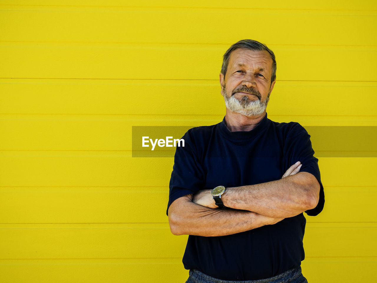 PORTRAIT OF A MAN WEARING YELLOW WALL