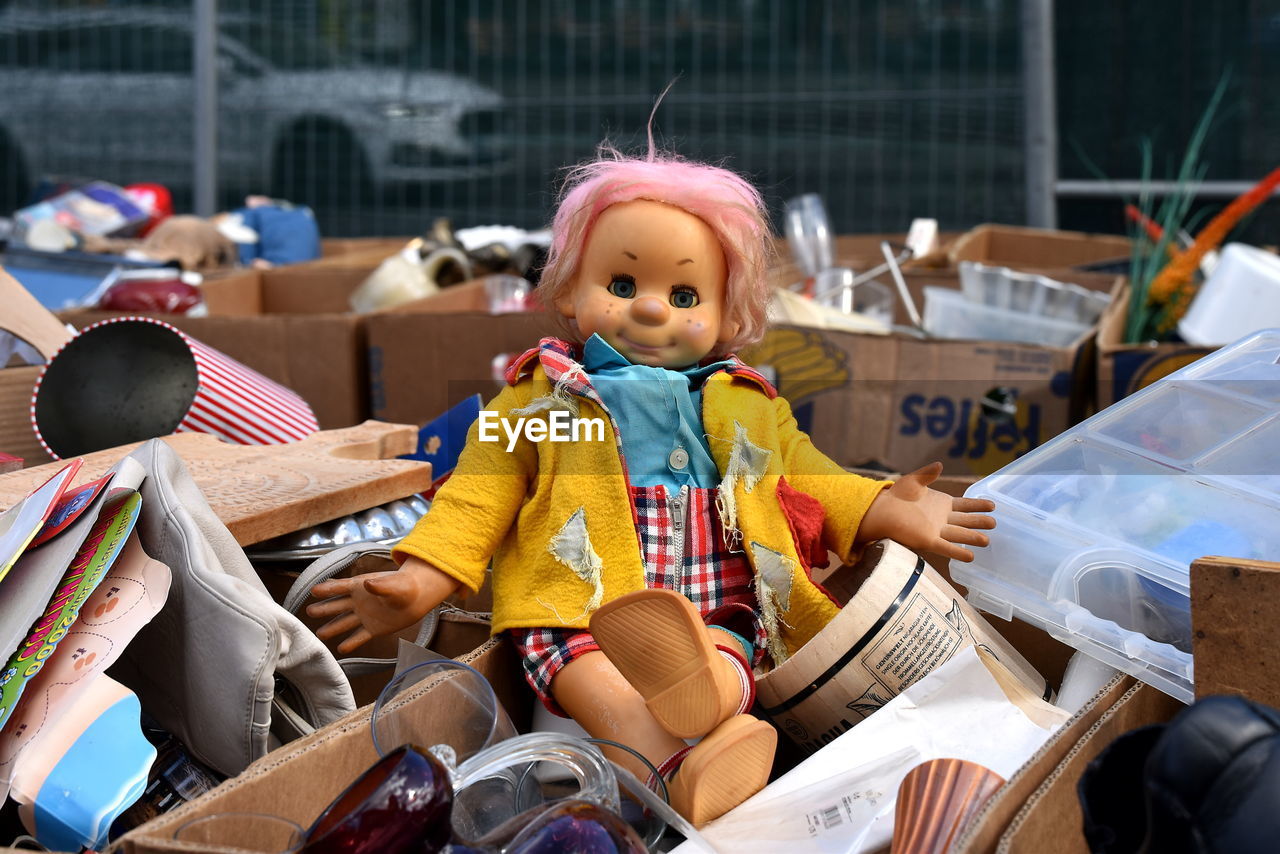 childhood, child, sitting, one person, clothing, person, toy, day, full length, cute, portrait, innocence, women, baby, front view, female, looking at camera, outdoors, focus on foreground, doll, lifestyles