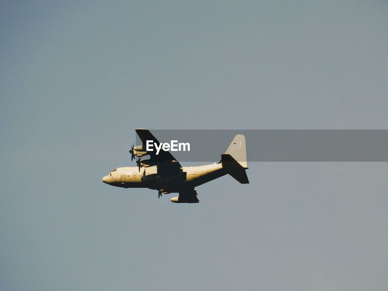 Low angle view of airplane flying in clear sky