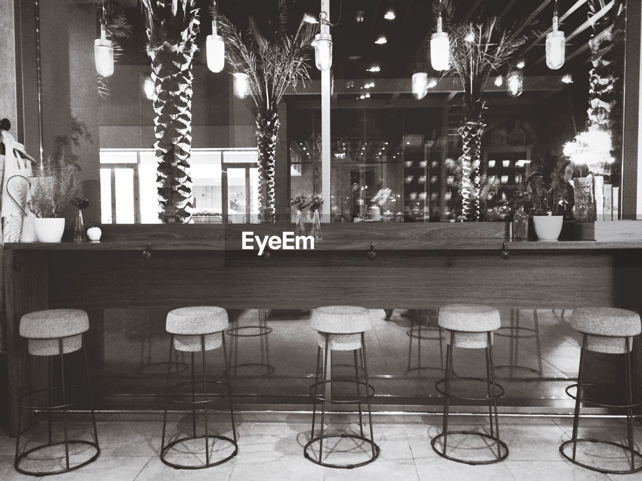 Empty stools by counter in restaurant