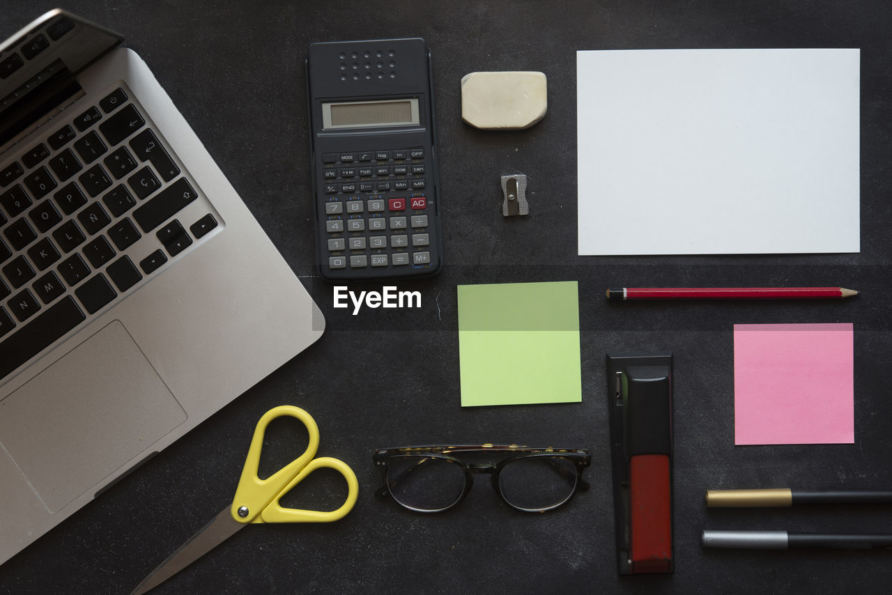 Directly above shot of office supplies on desk in office