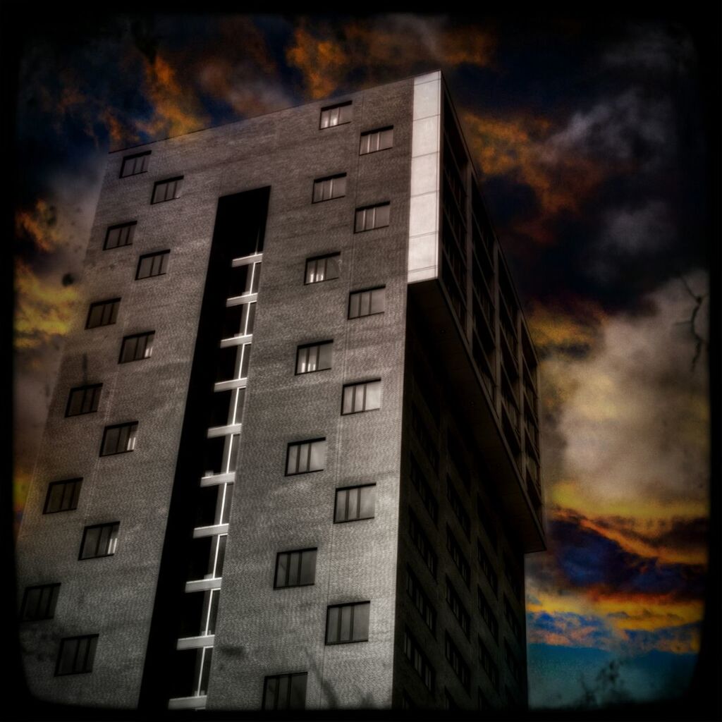 LOW ANGLE VIEW OF BUILDINGS AGAINST CLEAR SKY