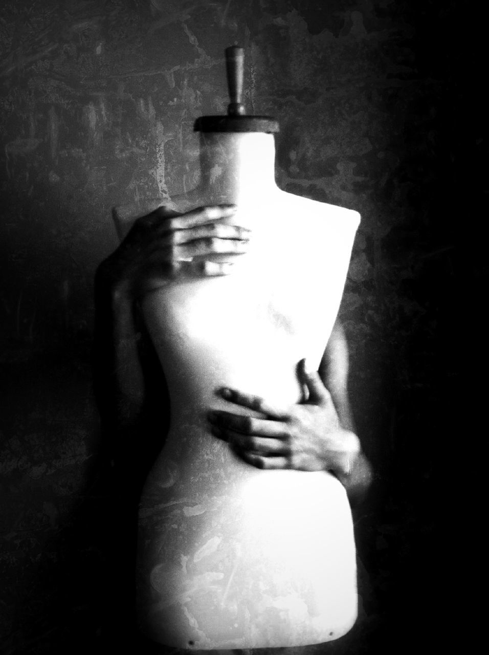 Cropped image of person holding mannequin