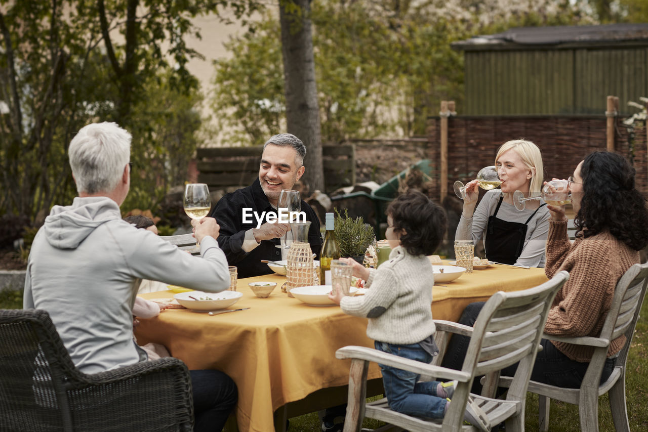 Family having meal in garden