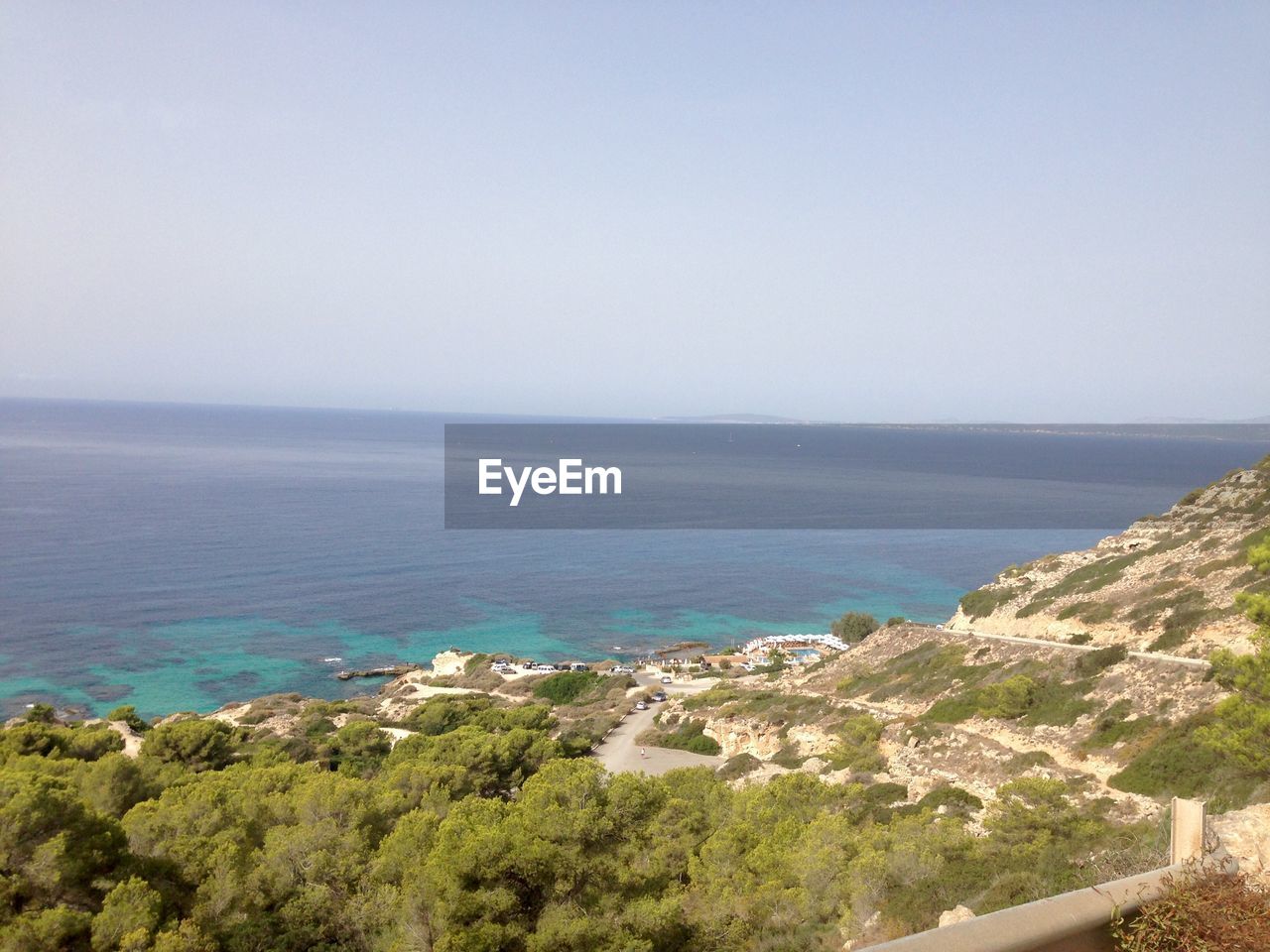 SCENIC VIEW OF SEA WITH TREES IN BACKGROUND