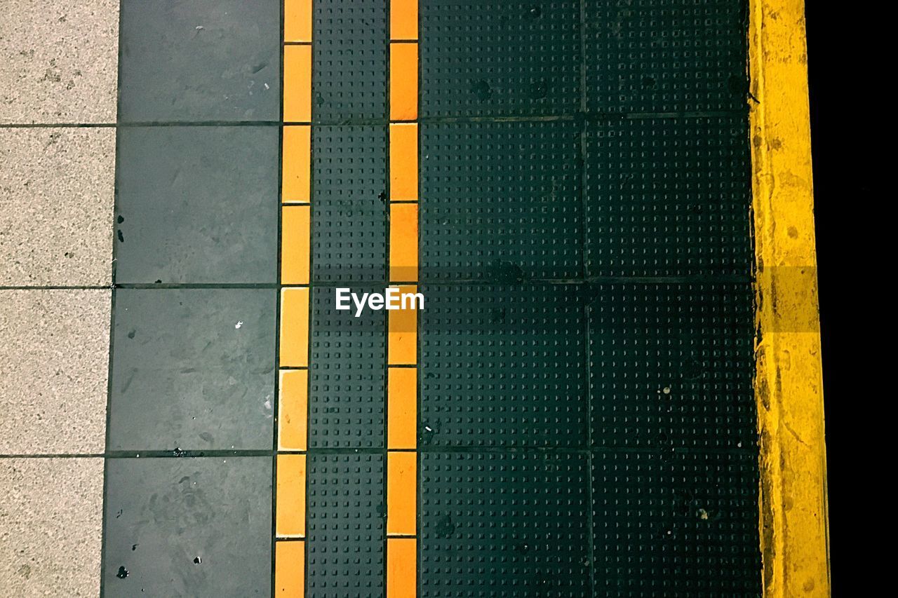 Full frame shot of yellow stripes at underground station