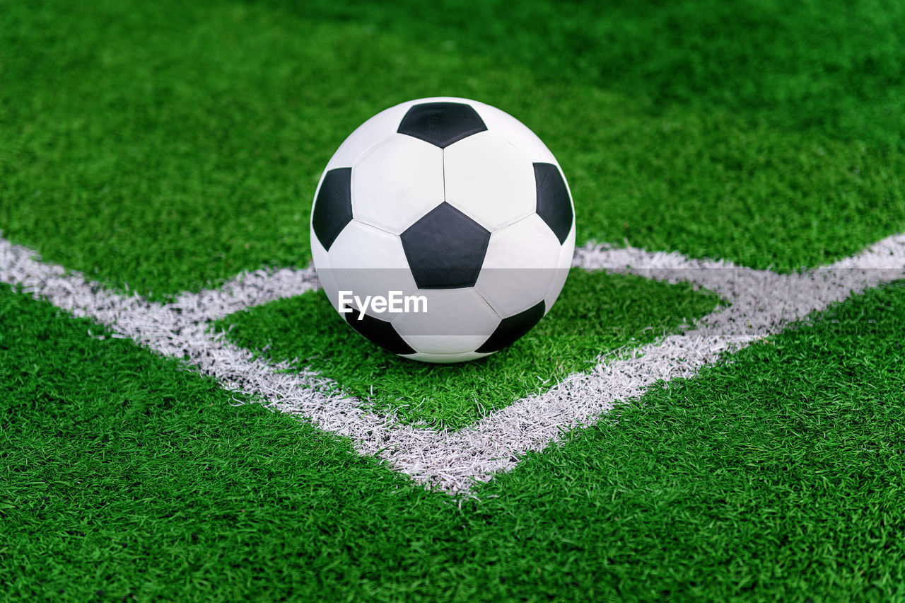 Close-up of soccer ball on field