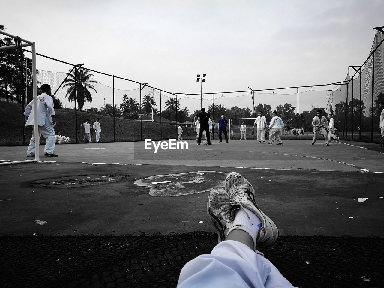 PEOPLE PLAYING SOCCER IN PARK