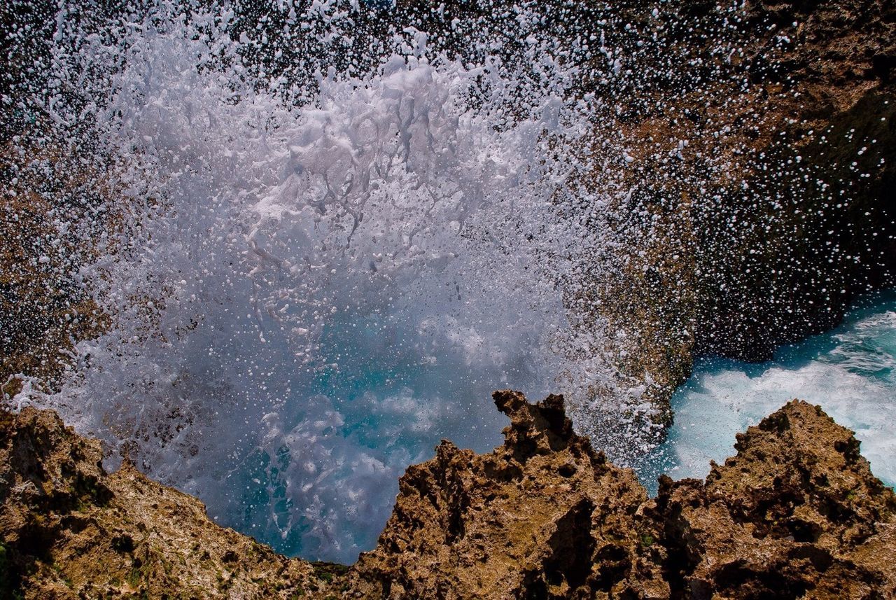 Close-up of water splashing on rocks