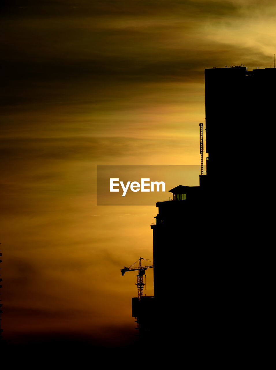 SILHOUETTE OF BUILDINGS AT SUNSET