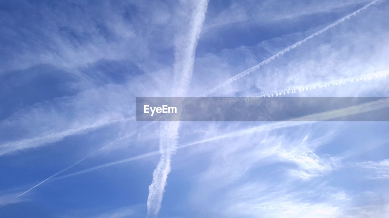 LOW ANGLE VIEW OF VAPOR TRAIL IN SKY