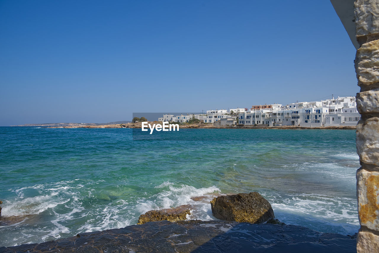 Scenic view of sea against clear blue sky