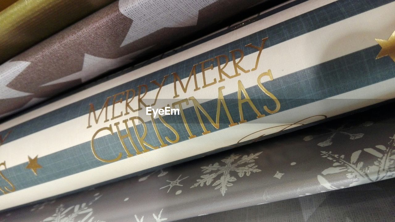 Close-up of merry christmas on paper
