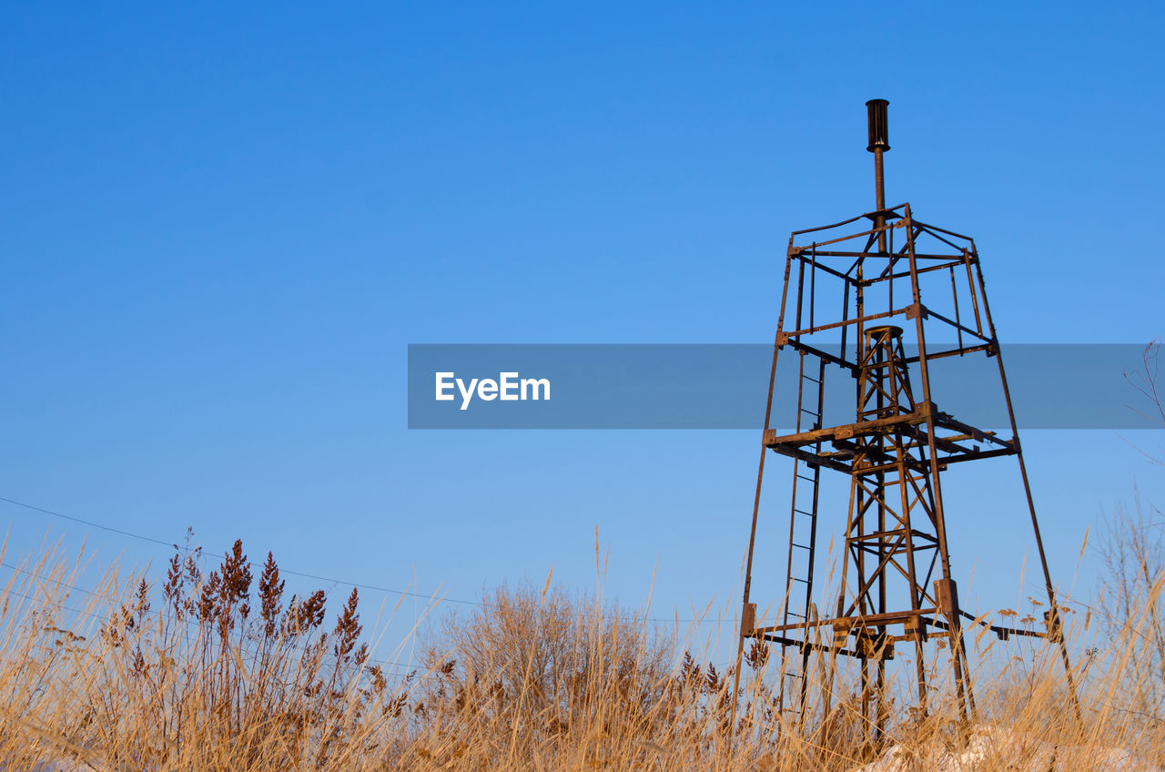 Metallic geodesic sign on a background of a blue sky in winter