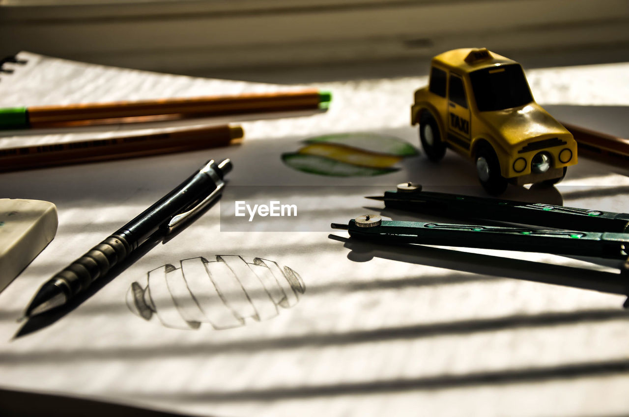 CLOSE-UP OF TABLE AND PEN